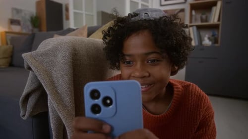 Child Using Phone in Modern Living Room