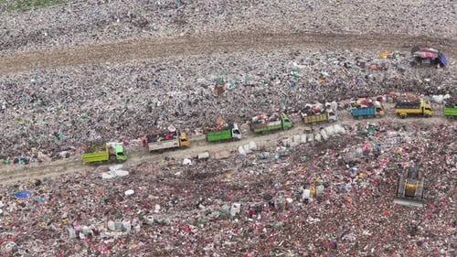 Garbage Trucks at Overfilled Landfill Site Pollution Problem