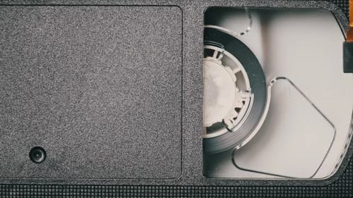 VHS Video Cassette Put Inside VCR Recorder and Playing