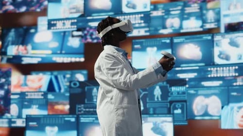 Virtual Reality Tech Used By Clinician Looking at Medical Reports