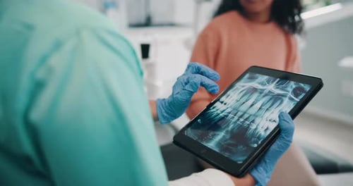 Clinic, patient and dentist with tablet screen for x ray, teeth diagnosis