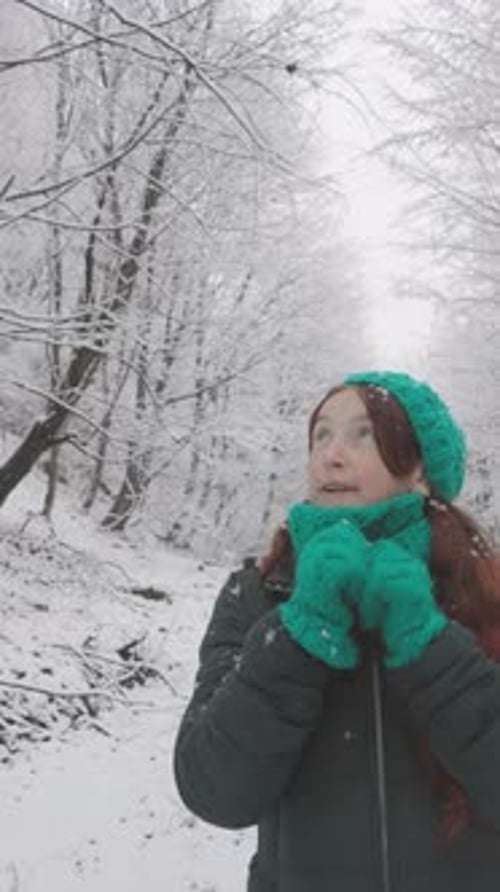 In a Serene Winter Forest Landscape Envision a Young Woman in a Cozy Green Knit Outfit Taking a
