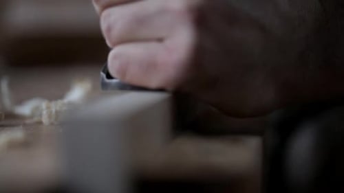 Close Up of Carpenter Using Plane Tool on Wood Block 3539 Years
