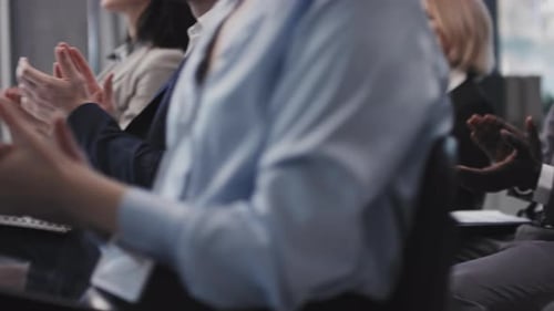 Group of Business Professionals Giving Applause at Conference
