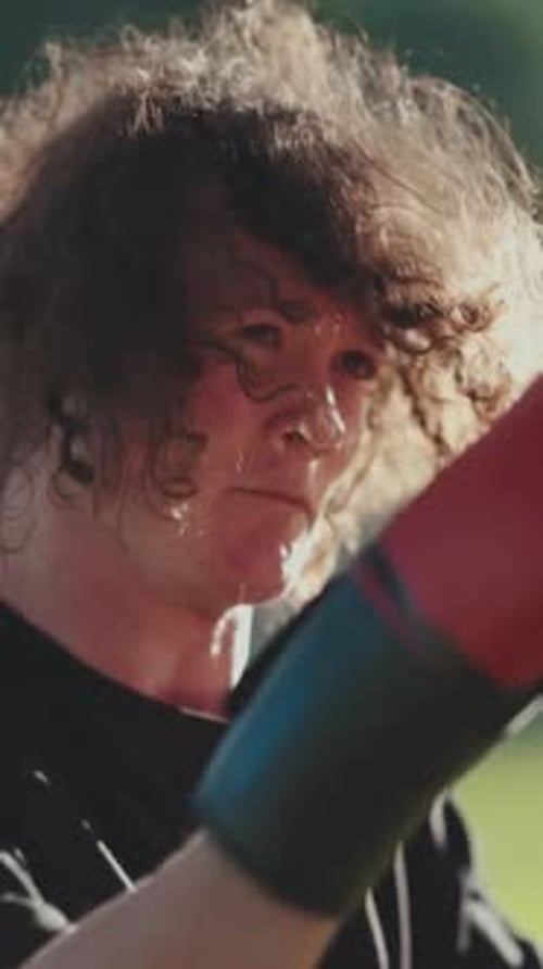 Young Athlete Practicing Boxing Punches in a Park