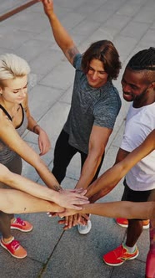 Team of Athletes Men and Women Stand in a Circle and Shake Hands Group of Likeminded People Group
