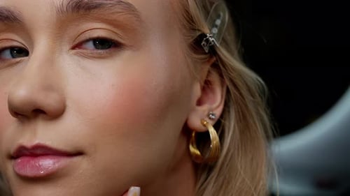 Woman Face Close-Up Wearing Hoop Earrings