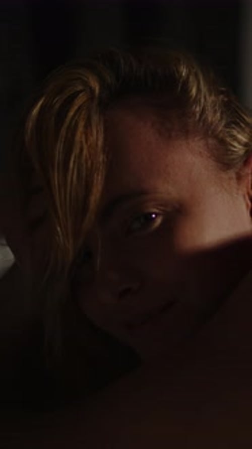 Blonde Woman Lying in Bed at Night