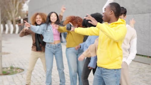 Multiethnic Young Friends Dancing in the Street