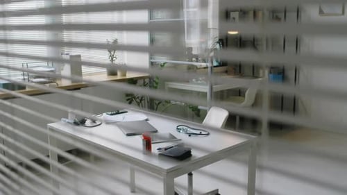 Doctors Office and Desk from Behind Window Blinds