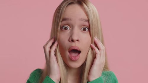 Blonde Woman with Shocked Expression and Open Mouth