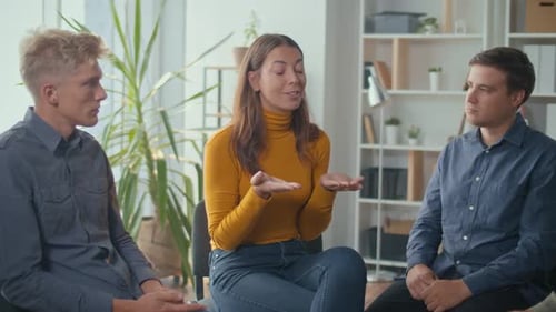 Adults Participating in Indoor Group Therapy Session