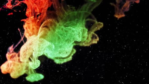 Colorful Ink Plumes Swirling in Dark Liquid