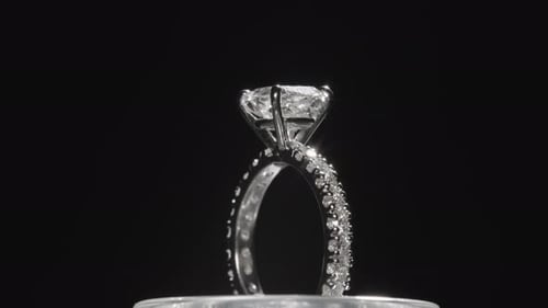 Beautiful Diamond Ring Rotating Elegantly Against a Black Studio Background