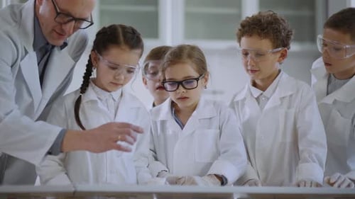 Children Learning Science Experiment with Adult Supervision