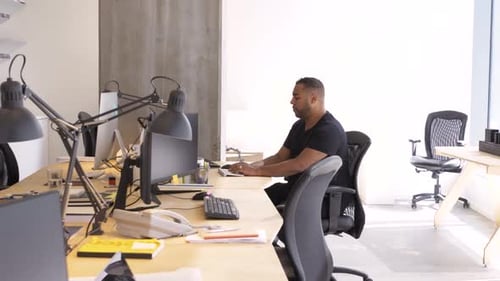 Man working at a computer in a modern office