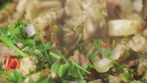 Chicken or Pork Stew with Red and Green Pepper Onion and Spices Cooking in a Frying Pan Traditional