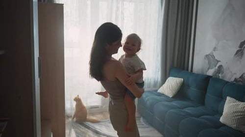 Loving Mother Holding her Child Indoors