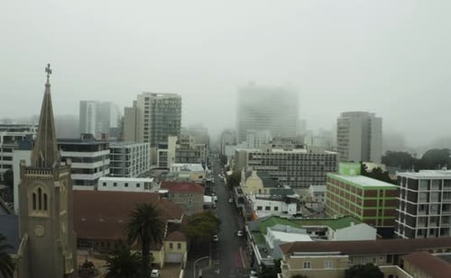 4k drone footage of mist over a city