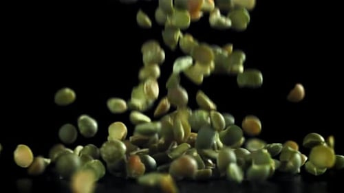 Green Peas Fall on the Table Filmed on a Highspeed Camera at 1000 Fps