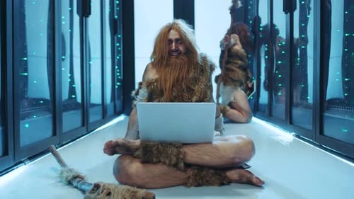 Cavemen Use Laptop in Server Room