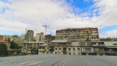 Cityscape View with Apartment Buildings and Cranes