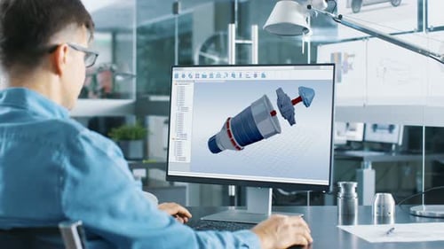 Engineer Designs Turbine on Computer in Modern Office