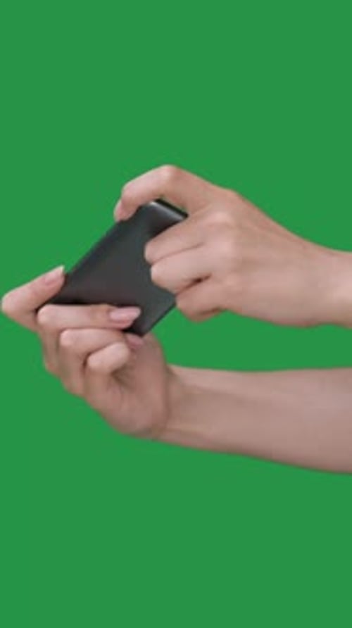 Hands Playing Mobile Game on Smartphone Green Screen