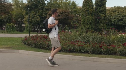 Man Walking Through Park