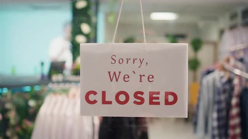 Closed Message on Clothing Store Door