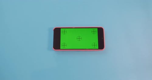 Hand Holding Smartphone With Green Screen