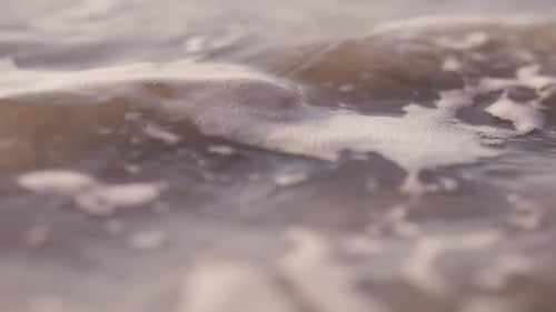 Sea waves rushing at the beach during sunset. Slow Motion Ocean White water Wave surf crashing.