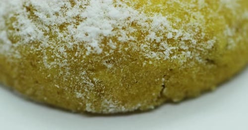 Close-up close up view of Christmas cookies in the form of a wheel decorated with sugar on its yello