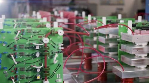 Electronic components and capacitors inside an electronic device. Close up tracking shot.