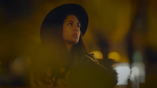 Stylish Woman with Camera Photographing at Night