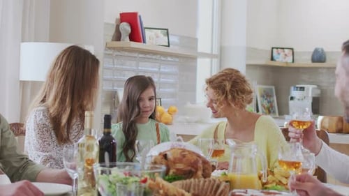 Family Sharing a Meal Together at Home