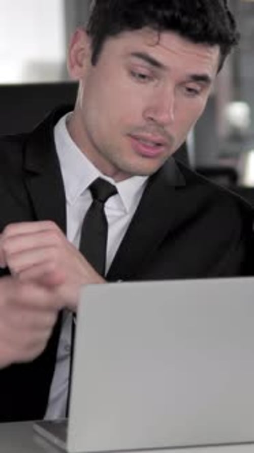 Serious Man Talking in a Video Conference