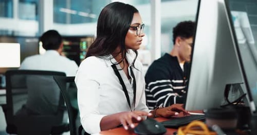 Woman, programmer and typing on computer in office for research, programming and software update