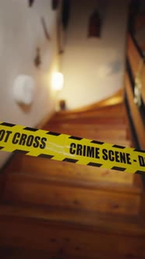 Crime Scene Tape Blocking Dark Staircase