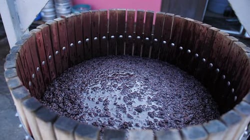 Closeup of Filling a Barrel with Grape Must for Fermentation