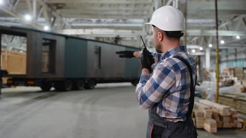 Construction Worker Coordinating Modular Home Transportation