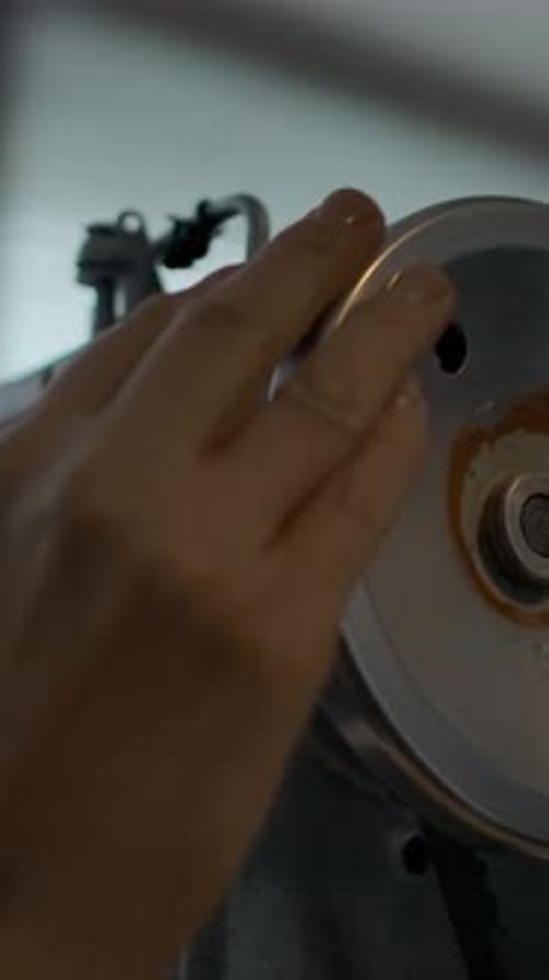 Vertical of Working on Industrial Sewing Machine Tailor's Hand Spinning Balance Wheel Atelier