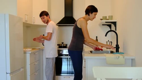 Couple Cooking Together in Modern Kitchen