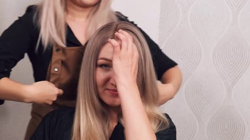 Blonde Woman Gets Beautiful Hair Styling at Salon