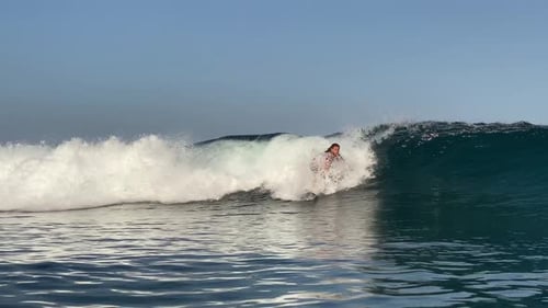 Young Man Surfing in the Ocean