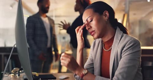 Night, headache and business woman tired working on computer in a corporate company office