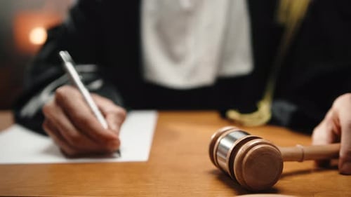 Judge Writes Verdict on Paper in Court