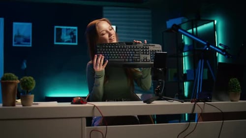 Young Adult Presenting Keyboard and Computer Mouse
