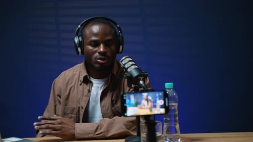 Man Recording Podcast in Home Studio