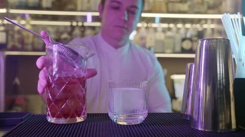 Bartender Preparing Alcohol Cocktails in Bar